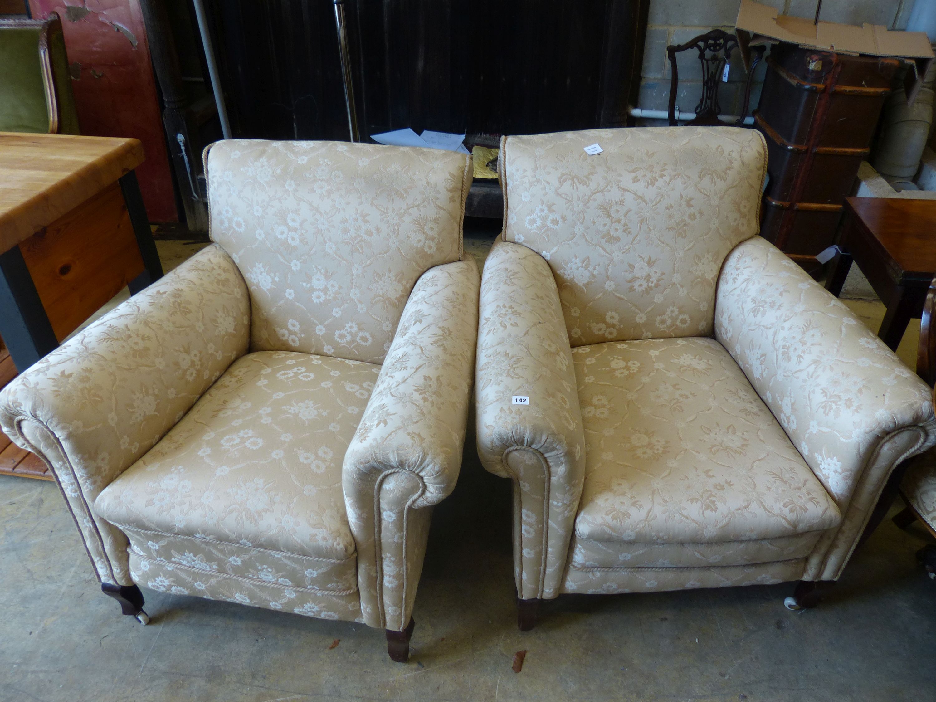 A pair of early 20th century upholstered armchairs, width 90cm, depth 94cm, height 94cm
